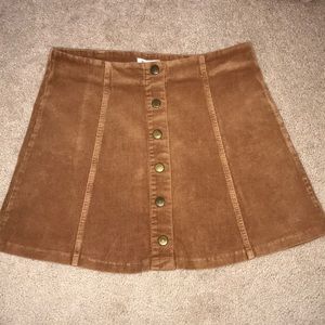 Corduroy mini skirt with snap buttons